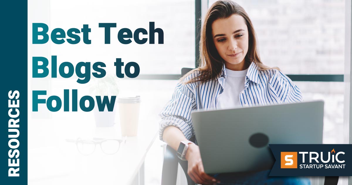 Woman looking at tech blog on her laptop.