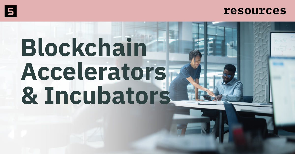 People working at a conference table.