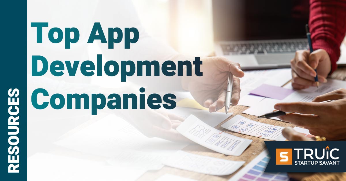 App development company meeting and looking at a paper prototype.