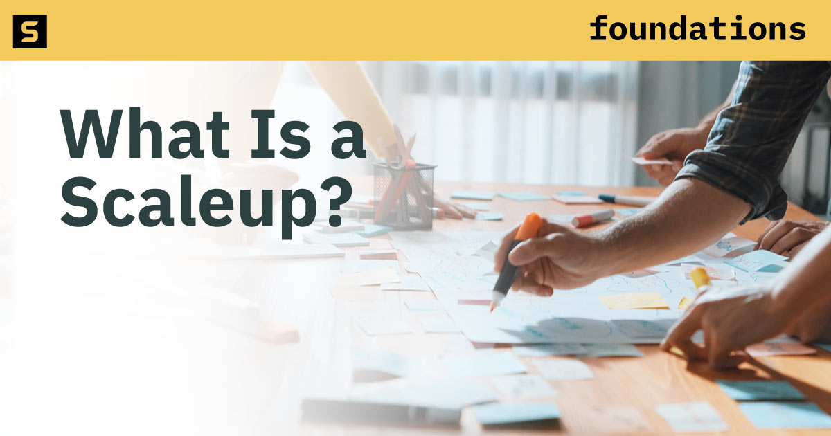 People working on documents on a table.